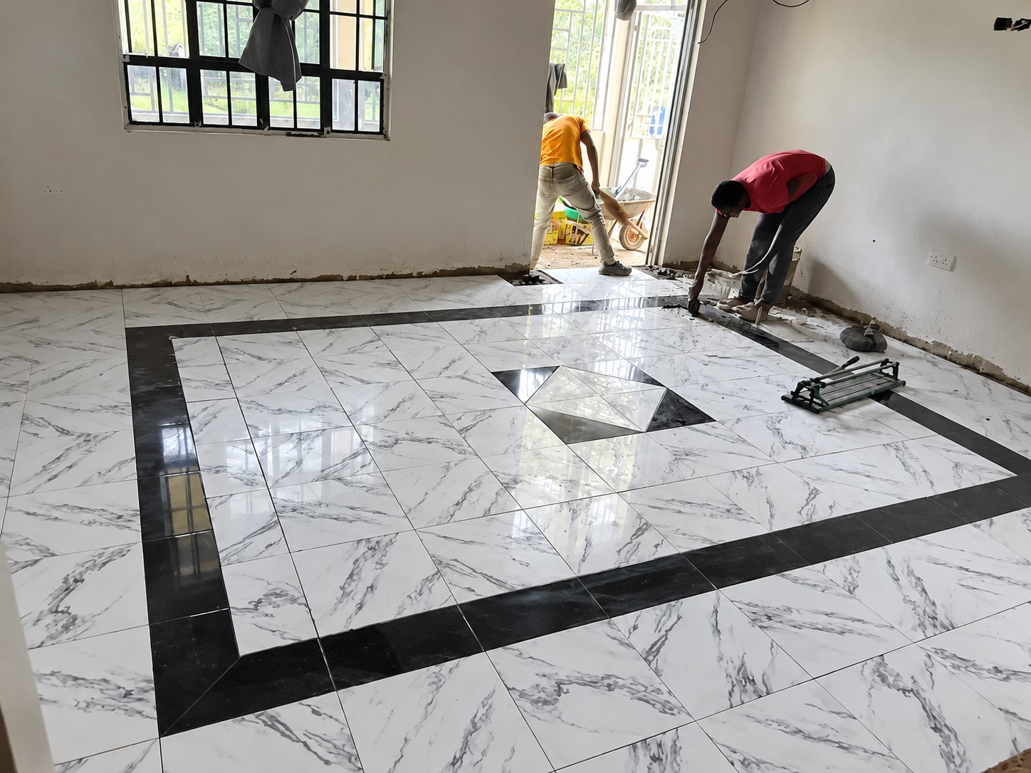 Living room tile layout with center medallion and border