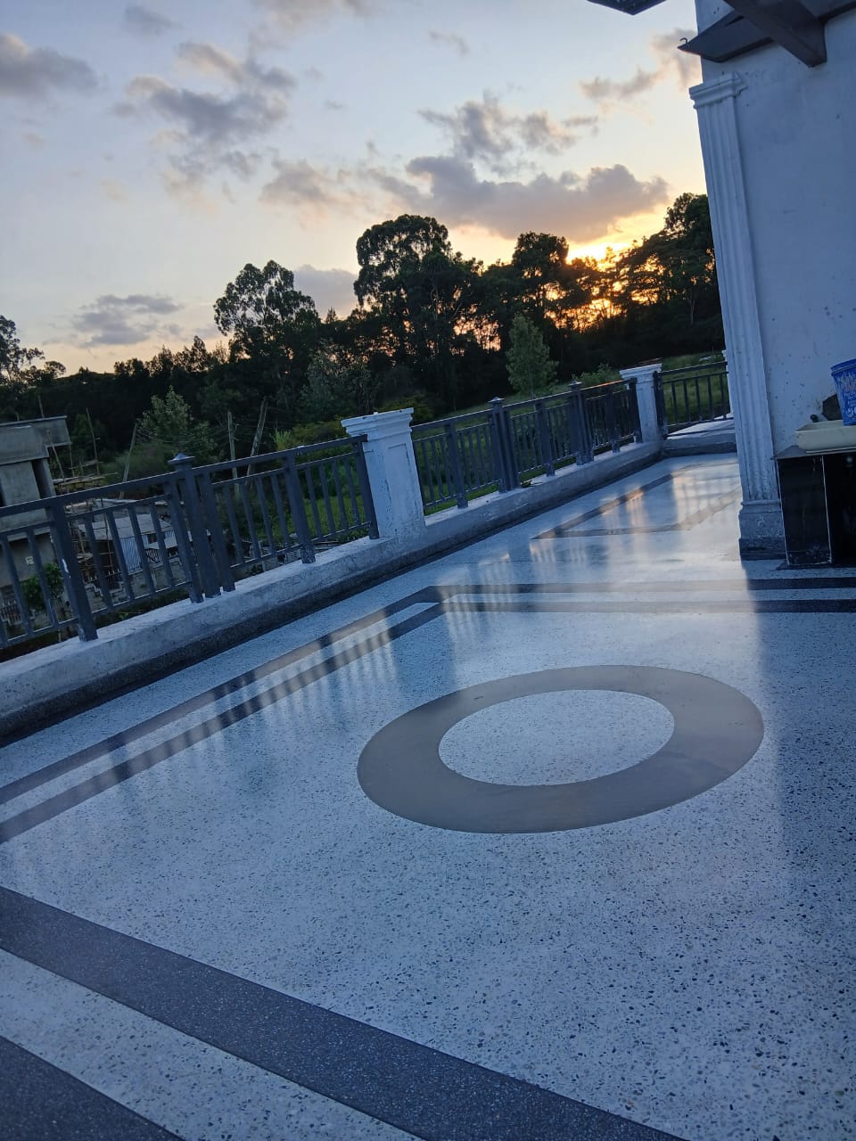 Rooftop terrazzo terrace with circle motif at sunset
